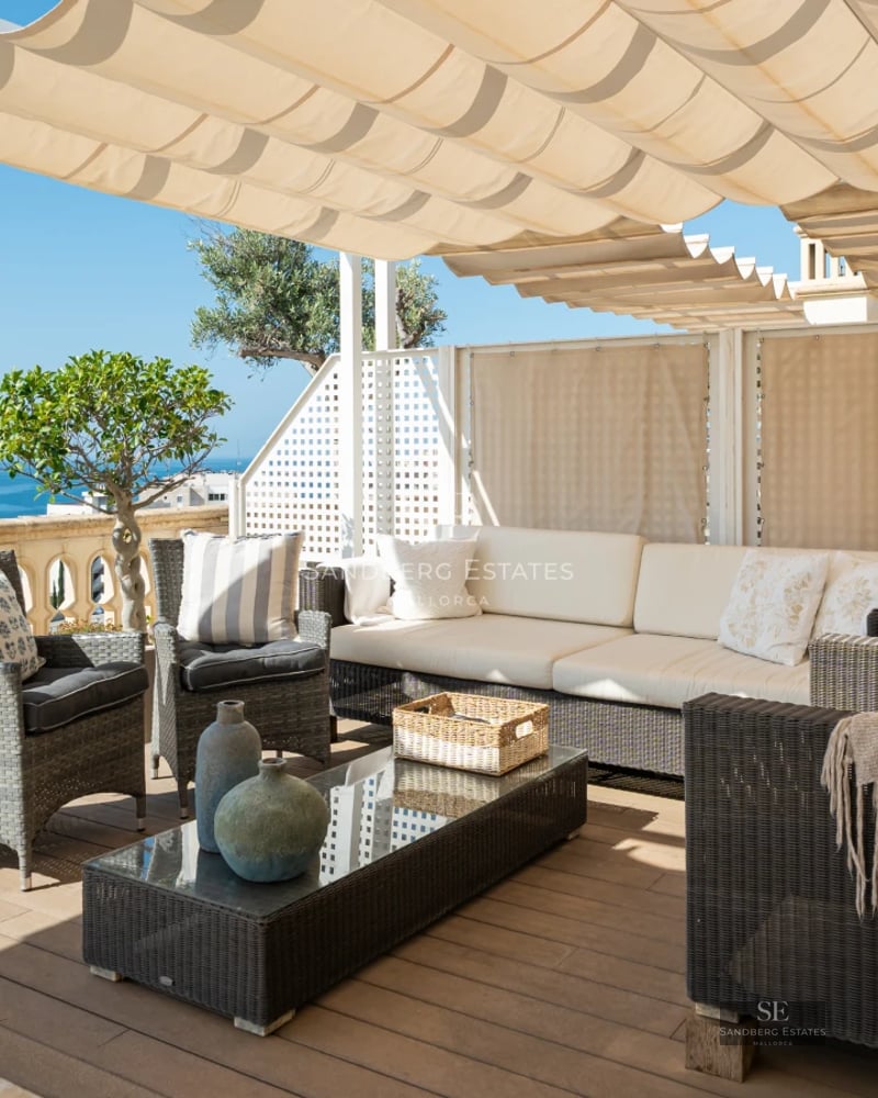 Exterior view of a modern villa featuring a pool, lush garden, and expansive windows. Contemporary architectural design.