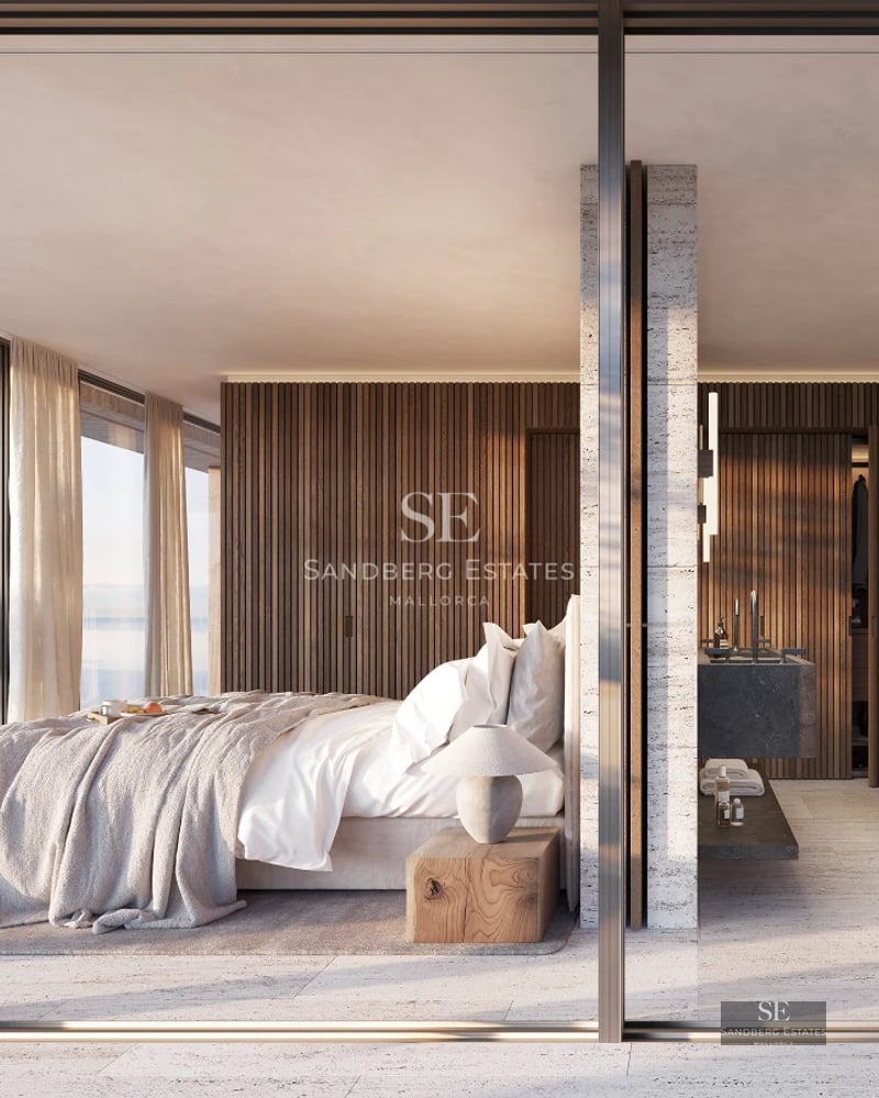 Spacious living room with panoramic windows, modern furniture, and stunning sea views. Elegant design and abundant natural light.