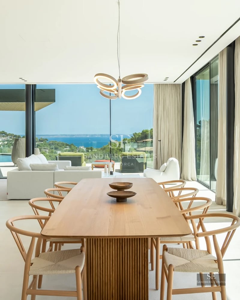 Pool view with lush garden and modern architecture. Open spaces, natural light, and sophisticated design.