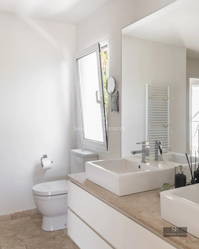 Spacious living room with large windows, panoramic sea views, and balcony access. Modern design, natural light, and high-quality finishes.