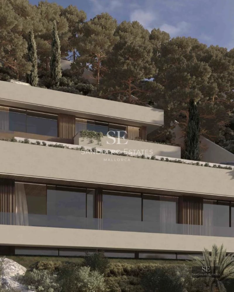 Spacious living room with large windows, terrace and sea view. Modern design, natural light, and high-quality finishes.