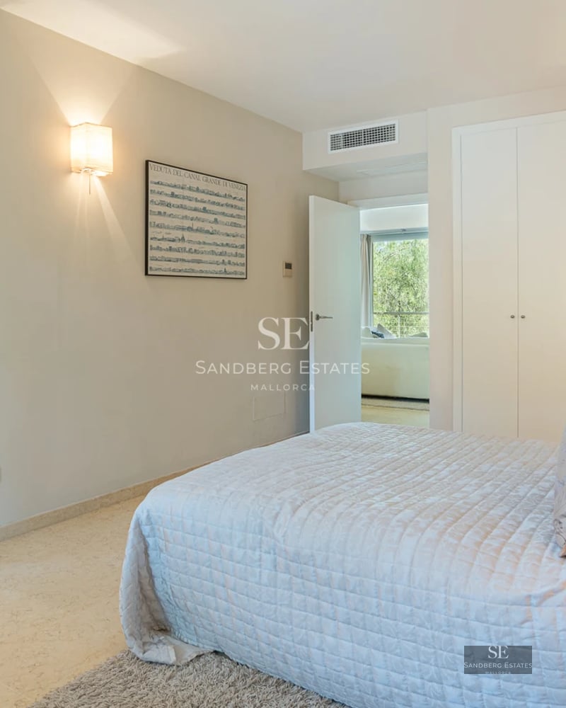 Exterior view of a modern villa with pool, surrounded by lush gardens. Elegant architecture featuring large windows and spacious terraces.