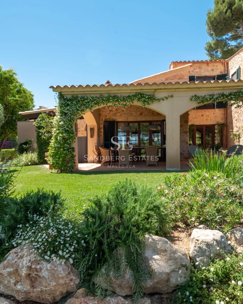 Spacious living room with panoramic windows, modern fireplace, and minimalist decor. Expansive views, abundant natural light.
