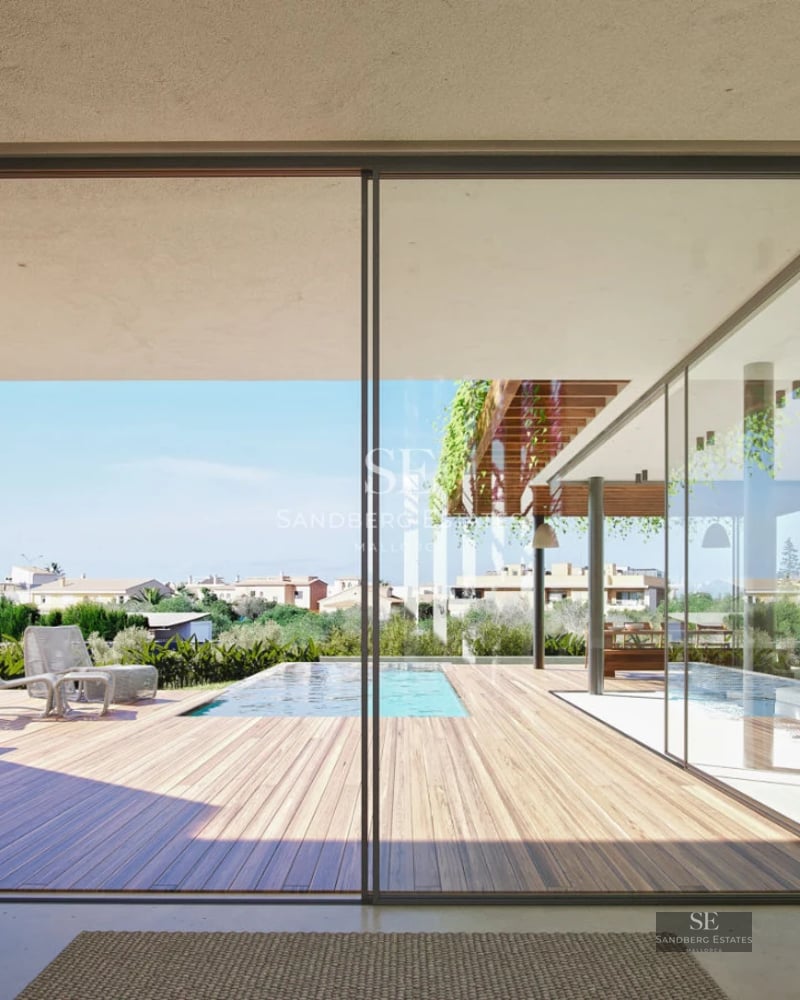 Exterior view of a modern villa with pool, sun loungers, manicured lawn, and minimalist architecture. Natural light and elegant design.