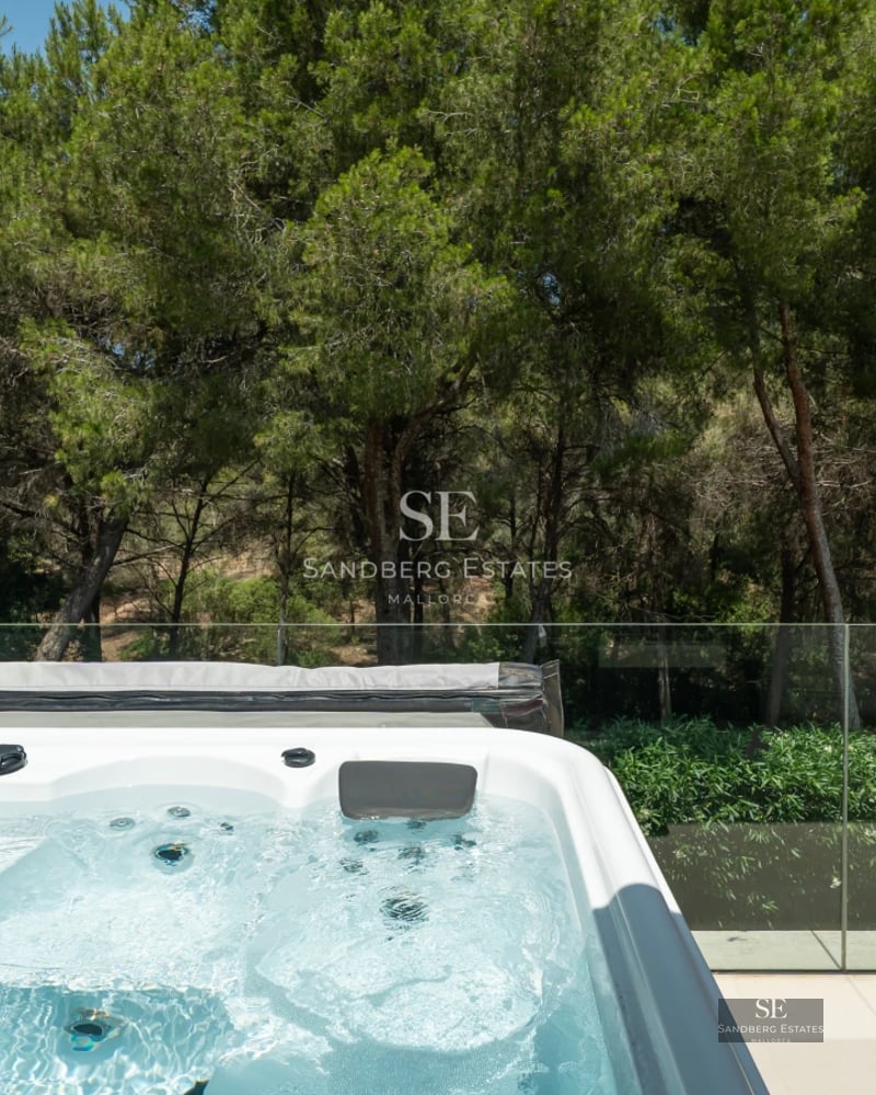 Spacious balcony with panoramic sea views. Modern design with elegant furniture and lush greenery. Ideal for relaxing and enjoying.