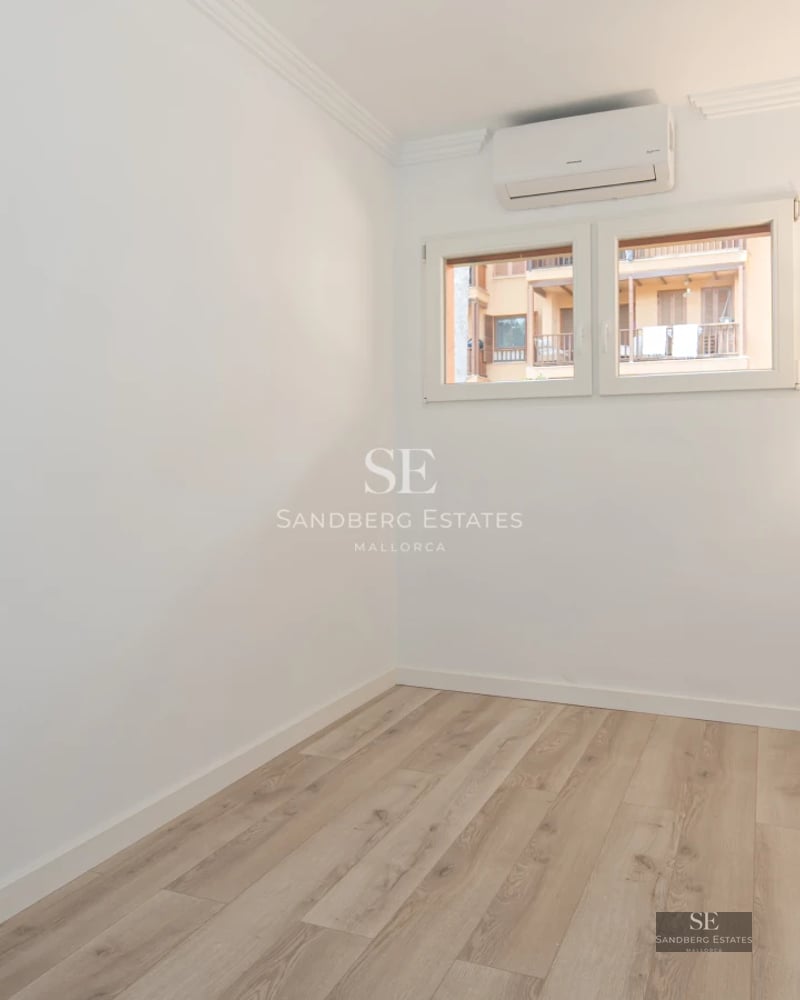 Exterior view of a modern villa with a pool, spacious terrace, lush greenery, and minimalist architectural design.