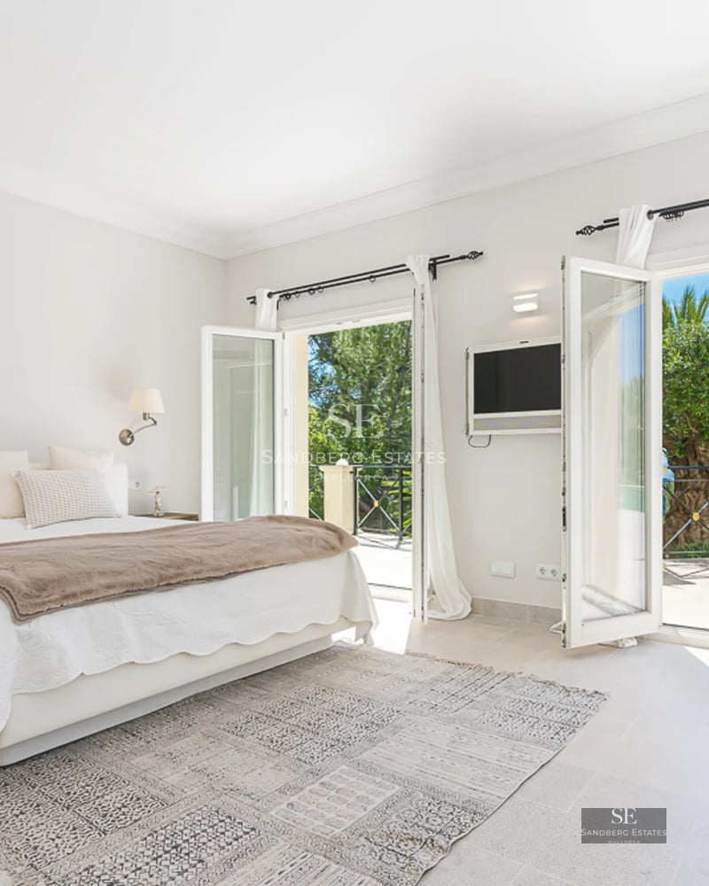 View of a luxurious villa with a pool, modern design, large windows, and lush garden. Perfect blend of indoor and outdoor living.