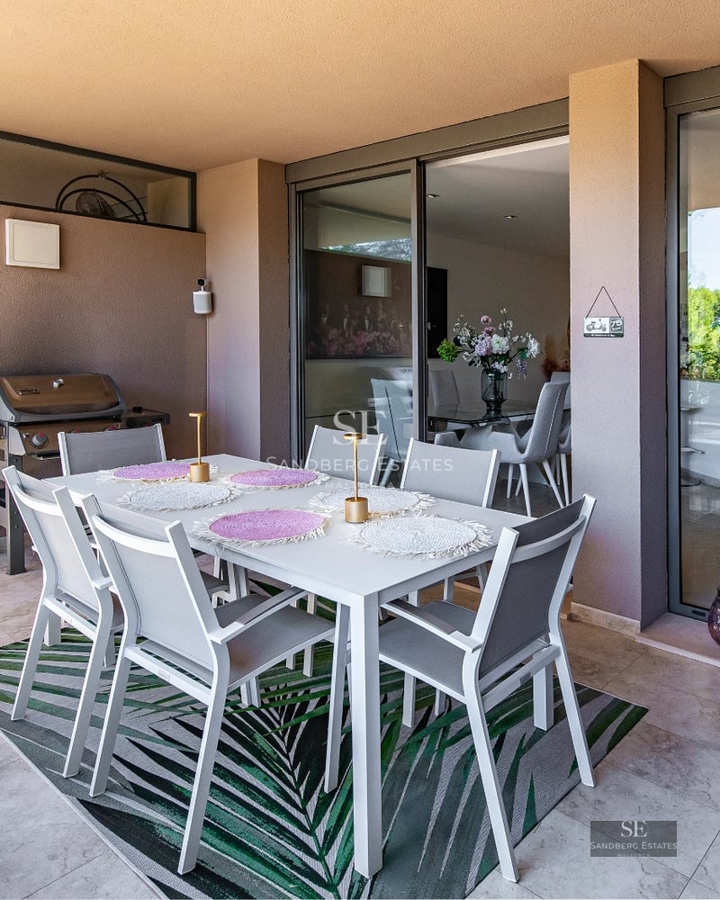 Exterior view of a modern villa with a pool, clean minimalist architecture, abundant natural light, and manicured landscaping.