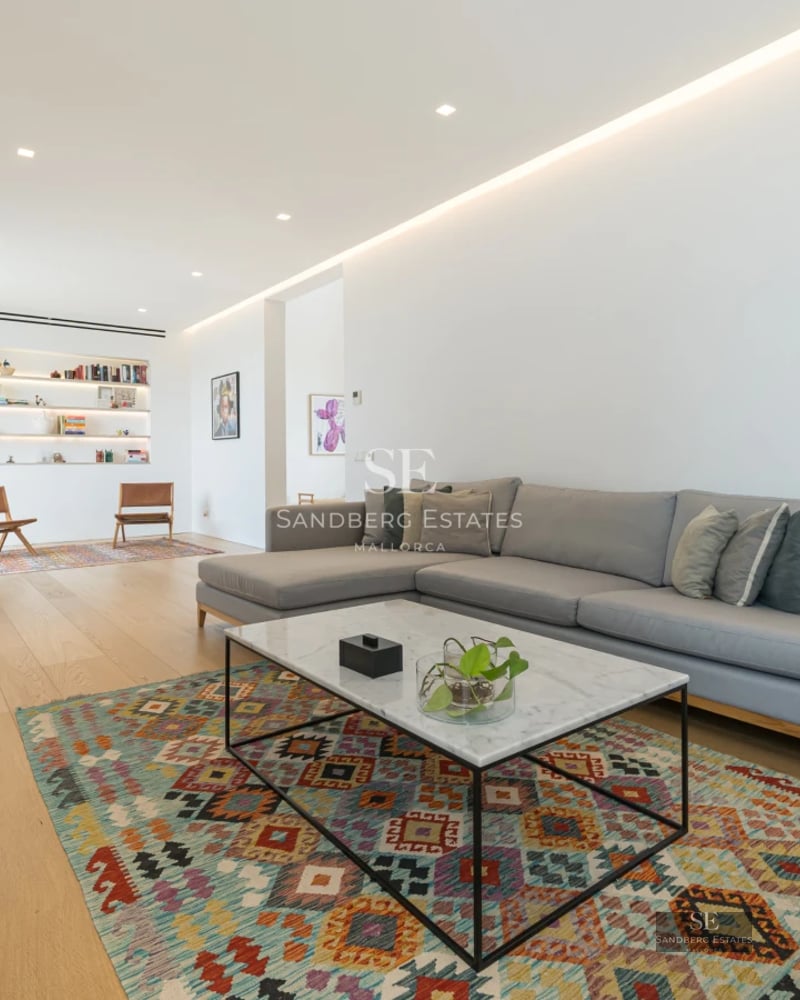 View of luxurious property with pool, manicured lawn, and modern architecture. Green grass and minimalist design.