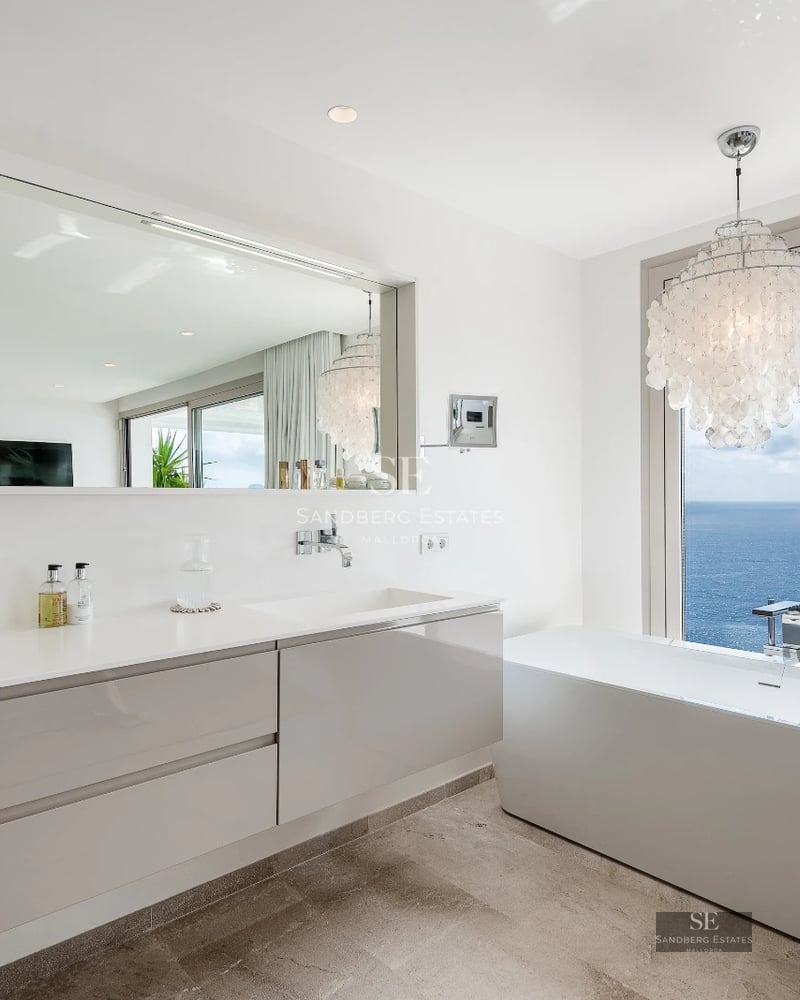 Exterior view of a modern villa with a pool. Minimalist architecture, large windows, and manicured landscaping. Ambient lighting.