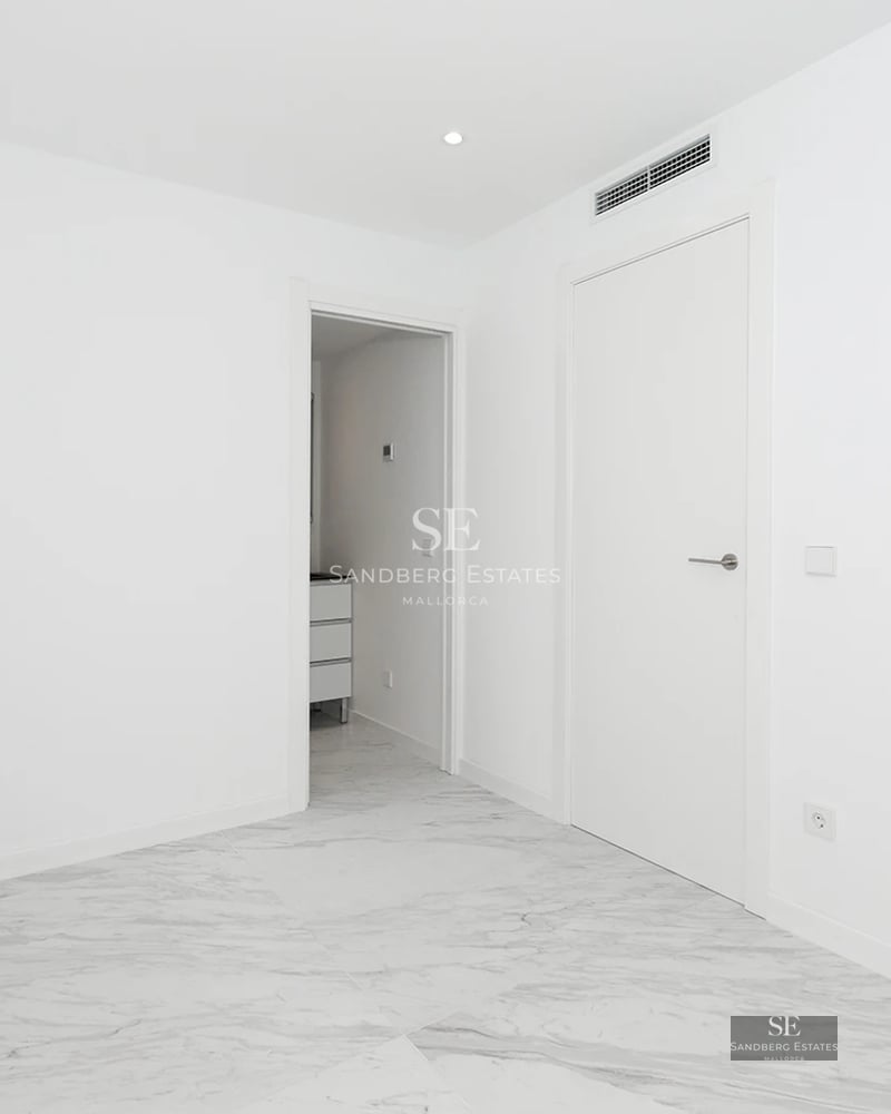 Exterior view of a modern villa with pool, minimalist design, and large windows. Warm ambient lighting.