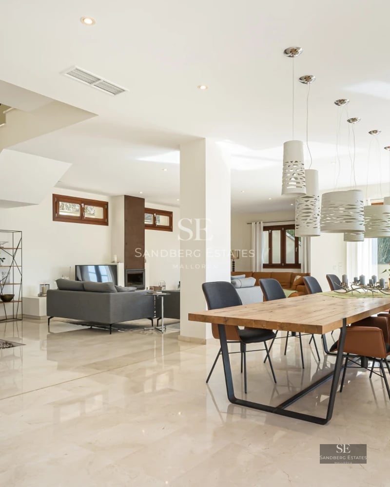 Exterior view of a modern villa with a pool, lush garden, and minimalist architecture. Natural lighting and high-quality finishes.