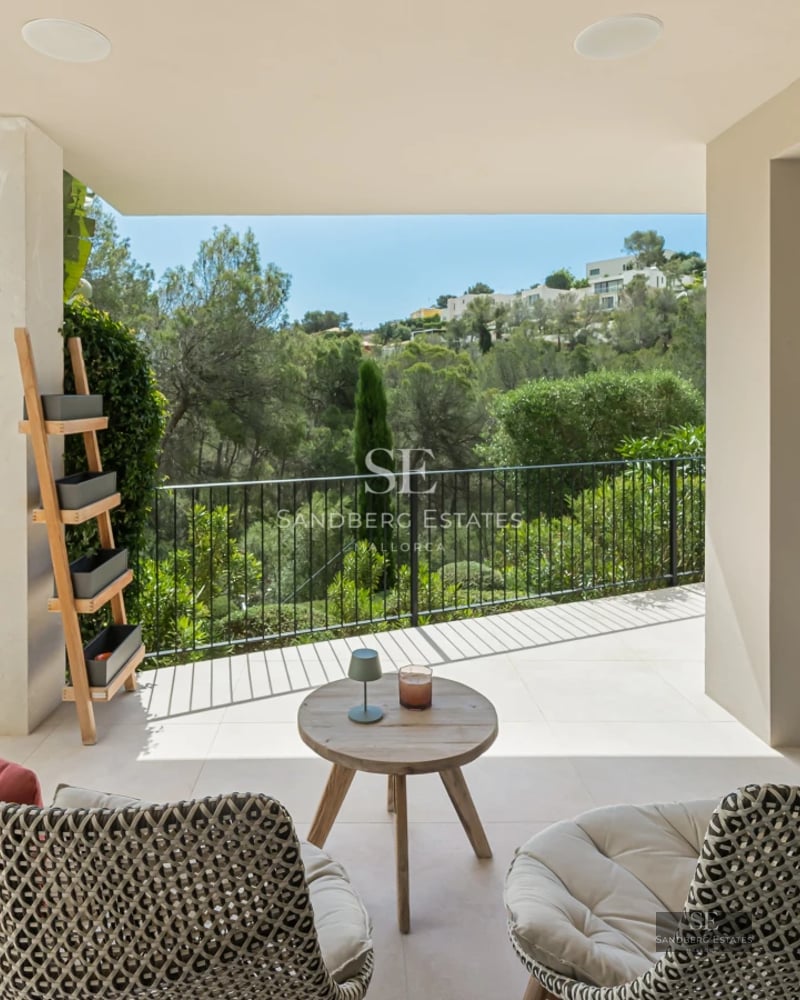 Exterior view of a modern villa with pool, terraces, and garden. Minimalist architecture with large windows and high-quality finishes.