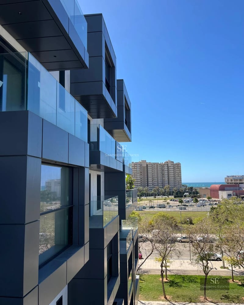 Exterior view of a modern villa featuring an infinity pool, lush garden, and minimalist architecture. Large windows and elegant design.