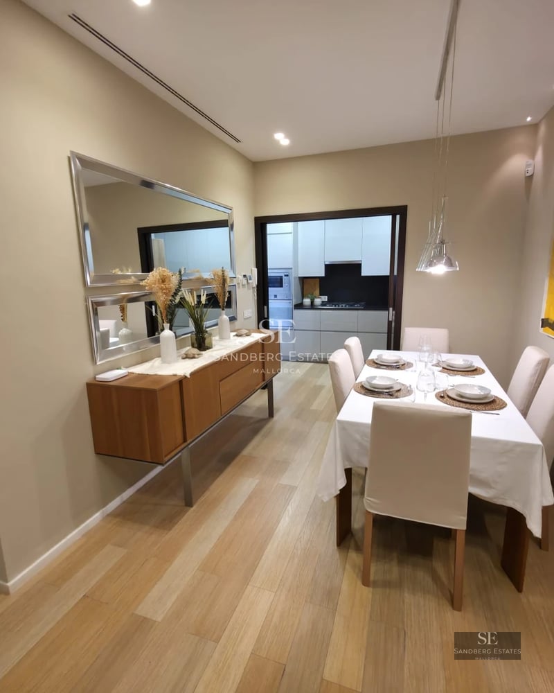 Aerial view of a modern villa with a turquoise pool and lush garden. Minimalist architecture, clean lines, and luxury finishes.