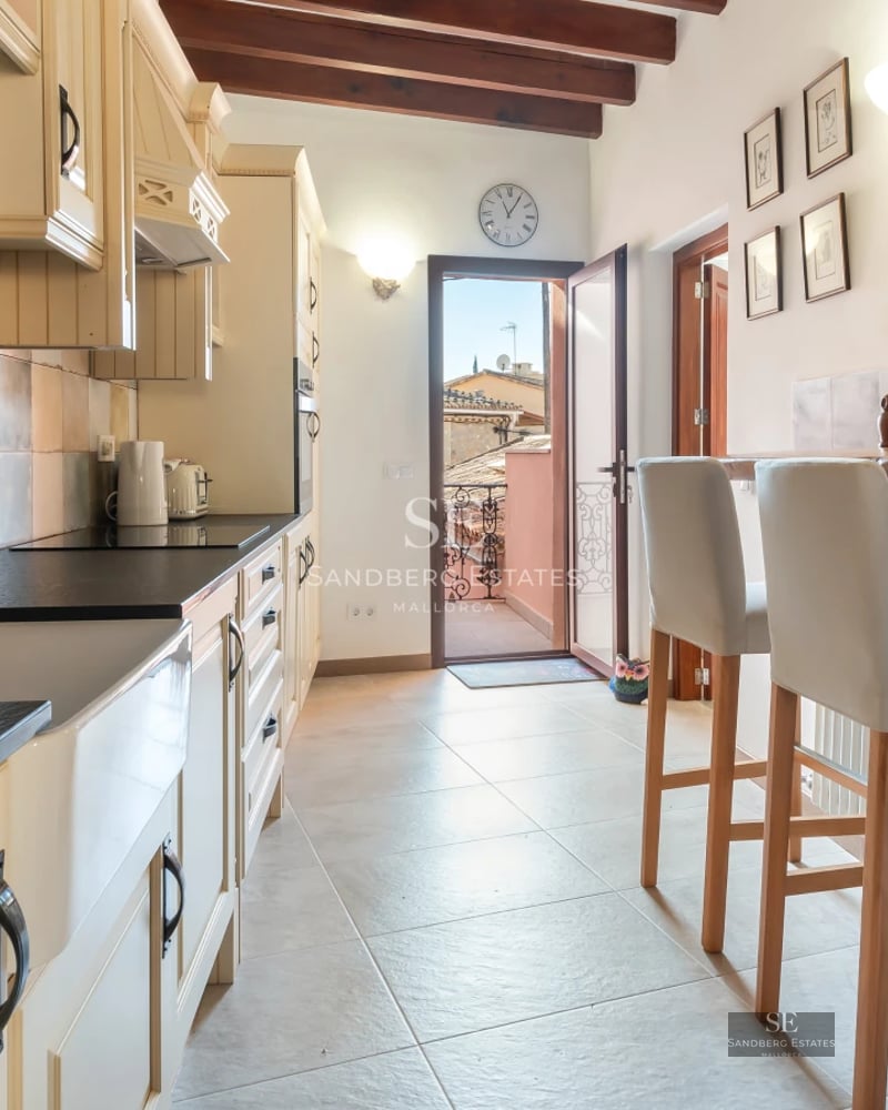 Bright living room with large windows, a modern fireplace, and elegant décor. Spacious sofas, designer coffee table, and soft rug.
