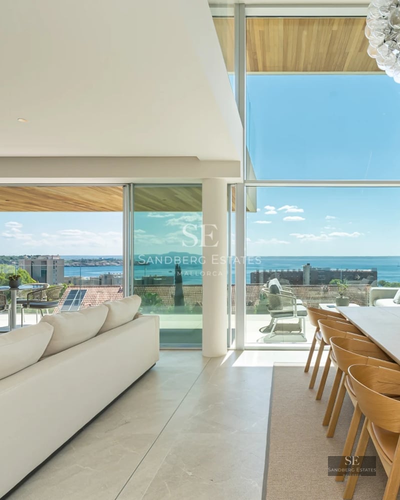 Exterior view of a modern villa with a pool, lush garden, and minimalist architecture. Elegant design and luxurious finishes.