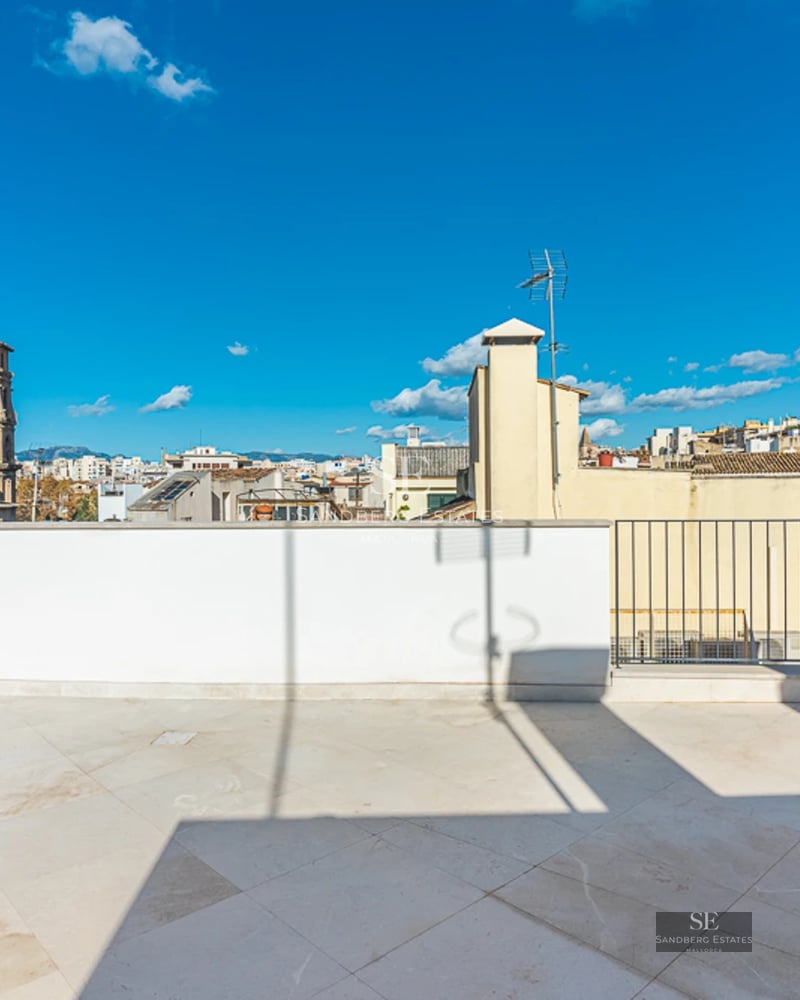 Exterior view of a modern villa featuring a pool, garden, and expansive terraces. Sleek architectural design with large windows and clean lines.