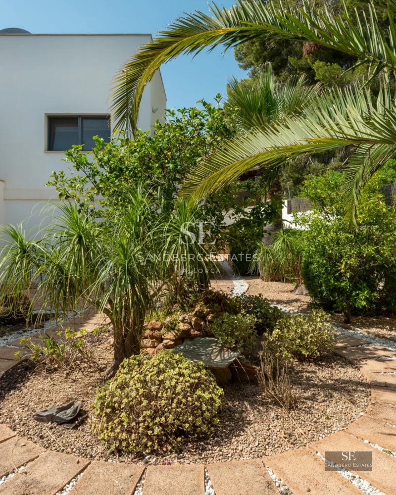 View of modern villa with infinity pool. Minimalist design, large terraces, and panoramic views. Warm lighting and serene environment.