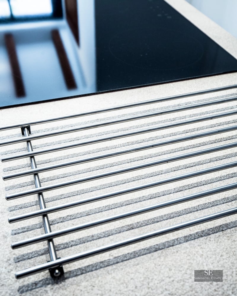 Expansive terrace with pool, modern furniture, and unobstructed views. Sleek, minimalist architecture.