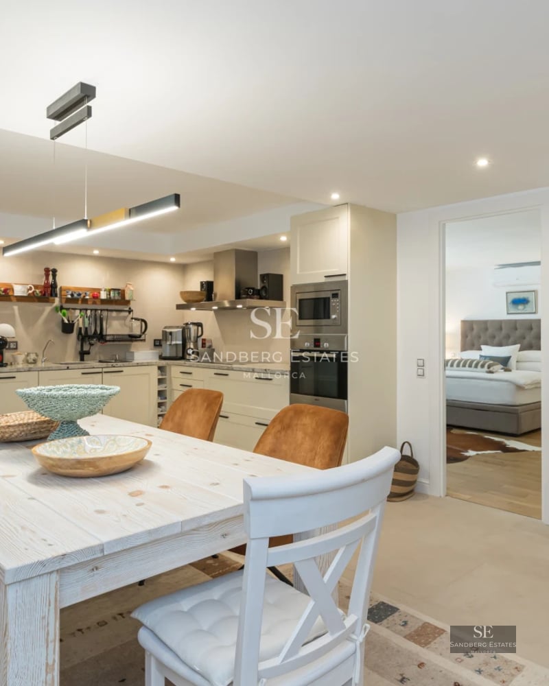 Exterior view of a modern villa with infinity pool, sun loungers, and lush greenery. Minimalist architecture with large windows.