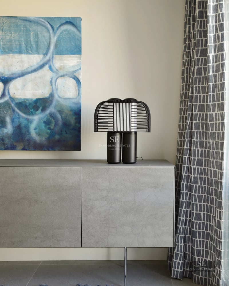 View of modern villa with infinity pool and terrace. Minimalist design, large windows, lush vegetation.