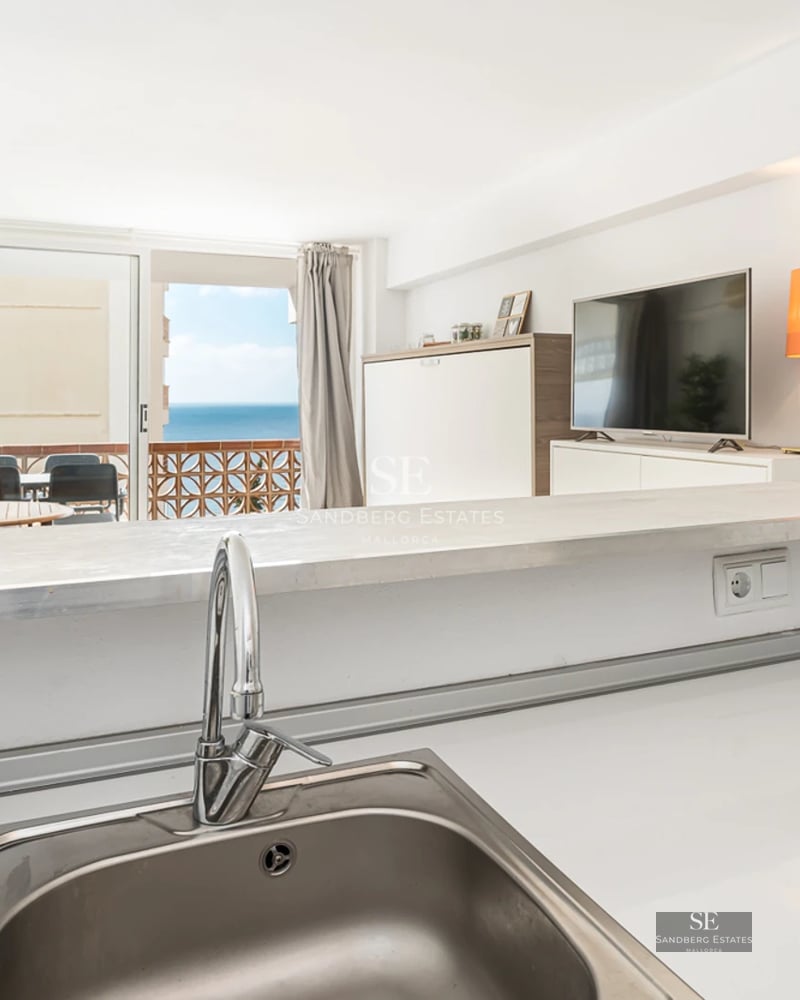 Spacious terrace with pool, sun loungers, and garden view. Modern architecture with large windows and minimalist design.