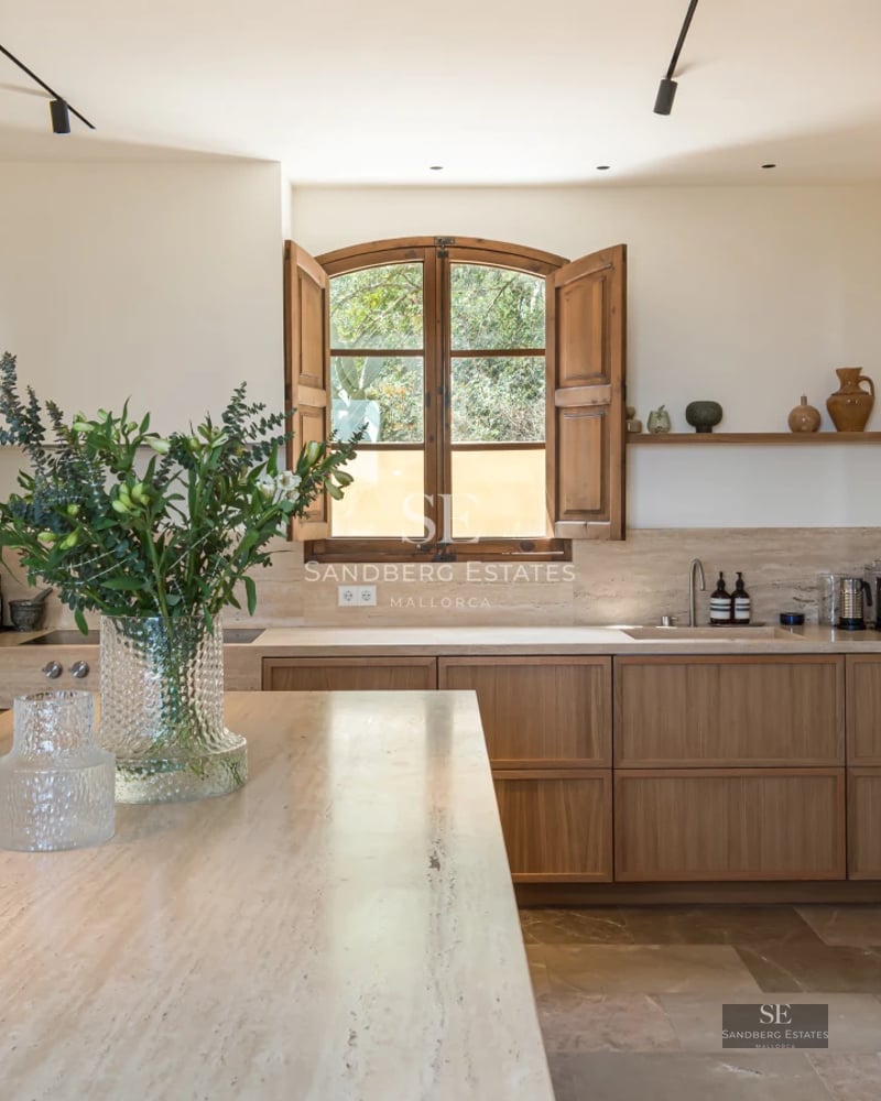 Aerial view of a modern villa featuring an infinity pool, lush garden, and minimalist architectural design. Bright and spacious.