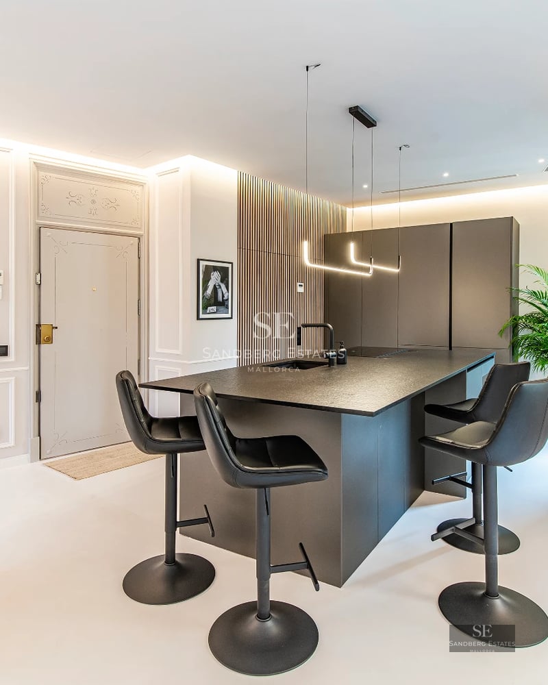 Expansive terrace with infinity pool and panoramic views. Modern design, glass railings, stylish furniture, and lush vegetation.