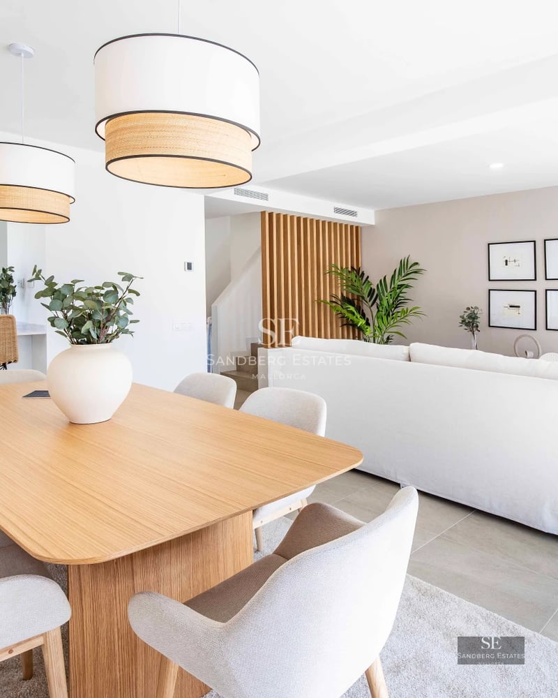 Property view showcasing an infinity pool and lush garden. Modern architecture and sleek design with ambient lighting.