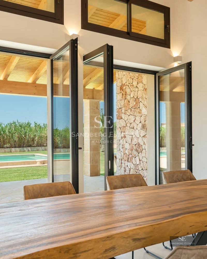 Spacious terrace with pool, sun loungers, and views. Modern architecture with clean lines and large windows. Luxury design.