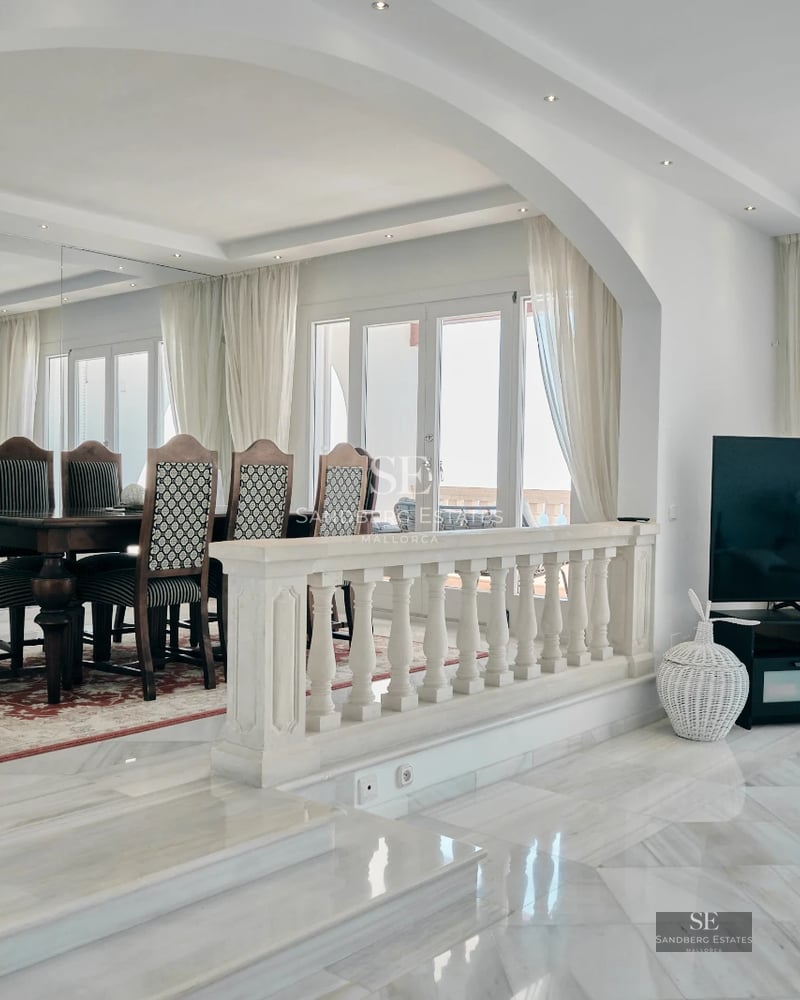 Spacious terrace featuring an infinity pool, sun loungers, and panoramic sea views. Modern design with clean lines and high-quality materials.