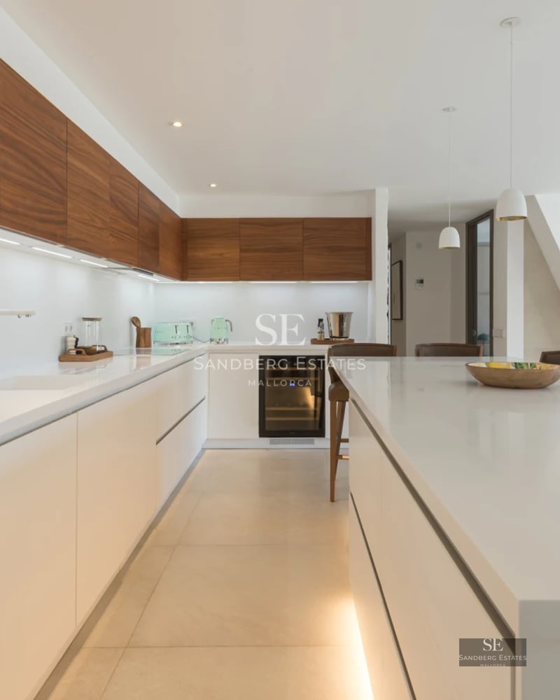 Exterior of a modern villa featuring an infinity pool, lush gardens, and spacious terraces. Minimalist design with panoramic windows.