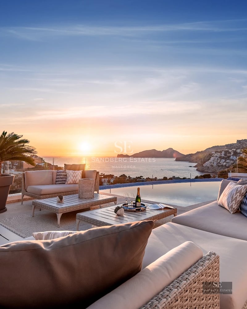 Exterior view of a modern villa featuring an infinity pool, lush garden, and minimalist architecture. Sleek design with large window panels.