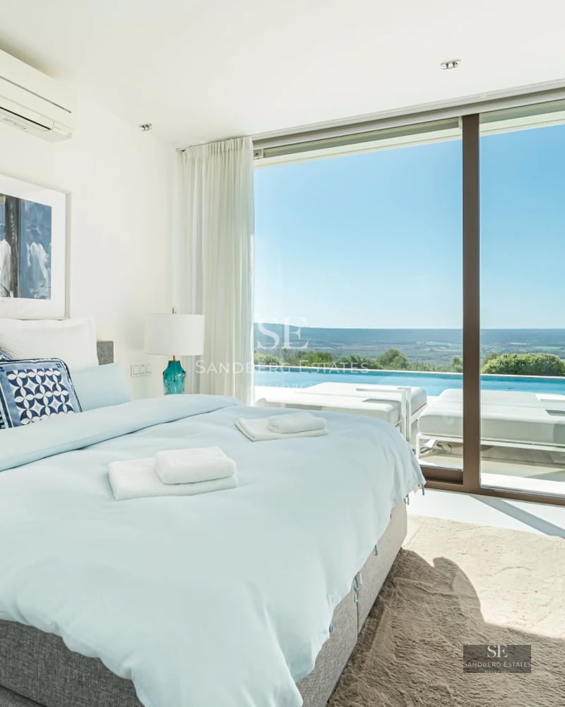 Spacious terrace with infinity pool, sun loungers, and panoramic views. Modern, elegant design with high-end outdoor furniture.