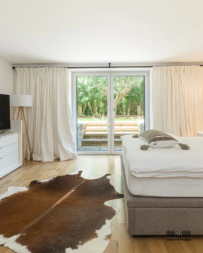 Modern penthouse with large windows, balcony with sea view and minimalist design. Bright and elegant interiors. High-end furniture.