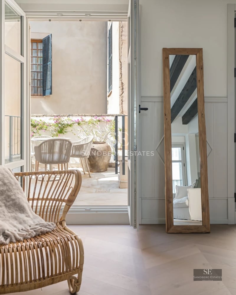 Pool view from terrace. Modern design, large swimming pool with solarium, minimalist architecture. Lush vegetation.