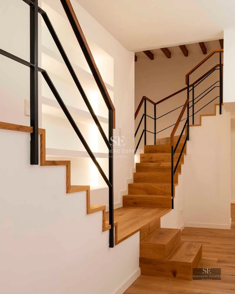 Spacious balcony with ocean views. Modern design with glass railing. Stylish and relaxing outdoor furniture.