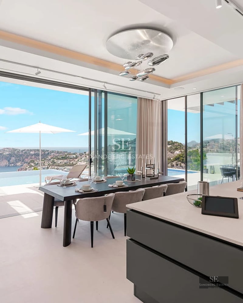 Spacious terrace with pool, sun loungers, and garden view. Modern design with wood and natural stone elements. Soft lighting.