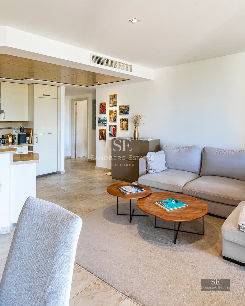 Exterior view of a modern villa featuring an infinity pool, large windows, and lush garden. Sleek and minimalist architectural design.