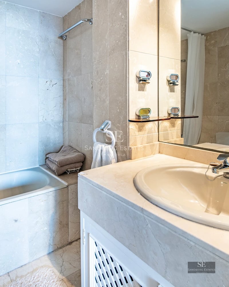 Exterior view of a modern villa with an infinity pool, spacious terraces, and lush gardens. Contemporary architecture with clean lines.