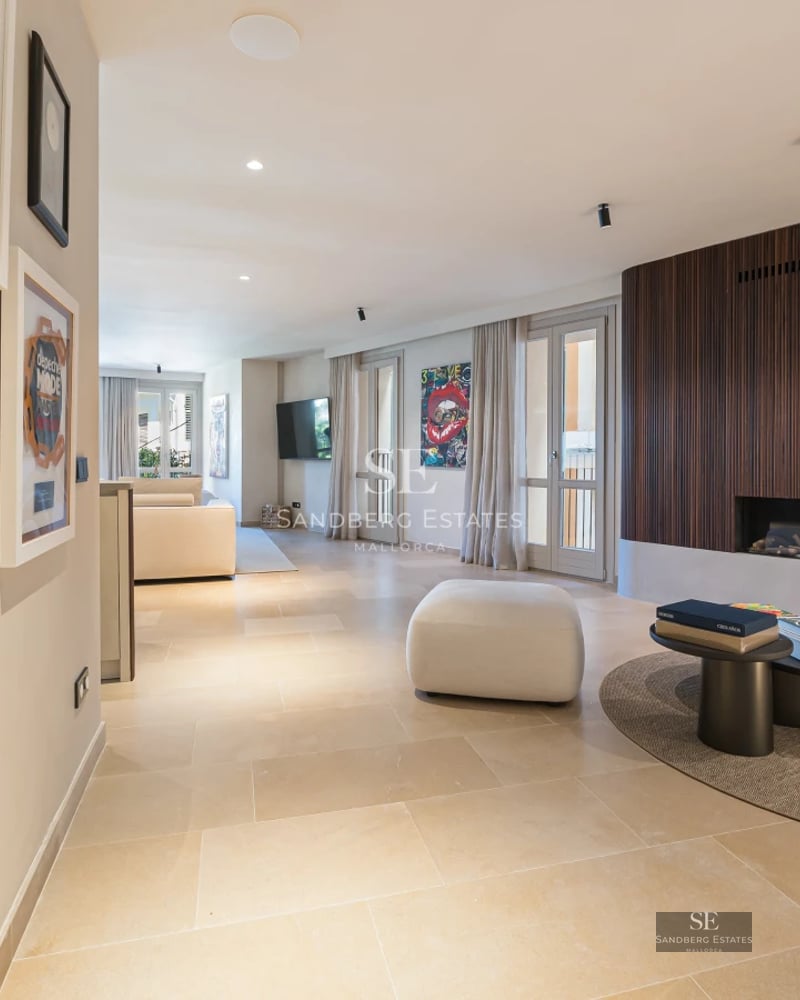 Expansive terrace featuring an infinity pool with ocean views. Modern design with elegant outdoor furniture and glass railings.