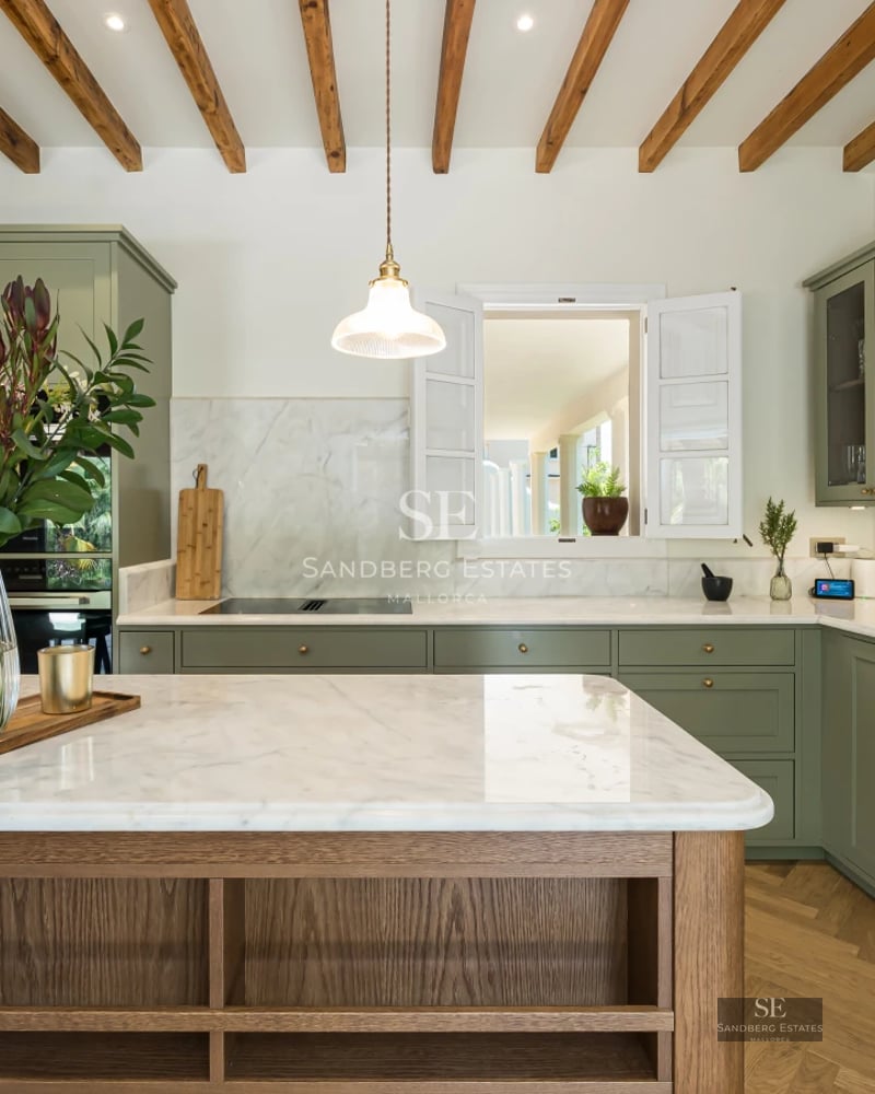 View of modern infinity pool surrounded by greenery. Minimalist design, ambient lighting, and ample space for relaxation.