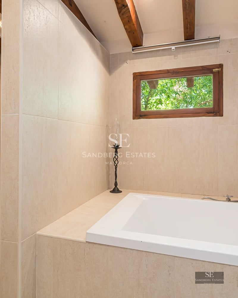 Expansive terrace featuring infinity pool. Ocean view. Modern design with sun loungers & umbrellas. Open spaces.