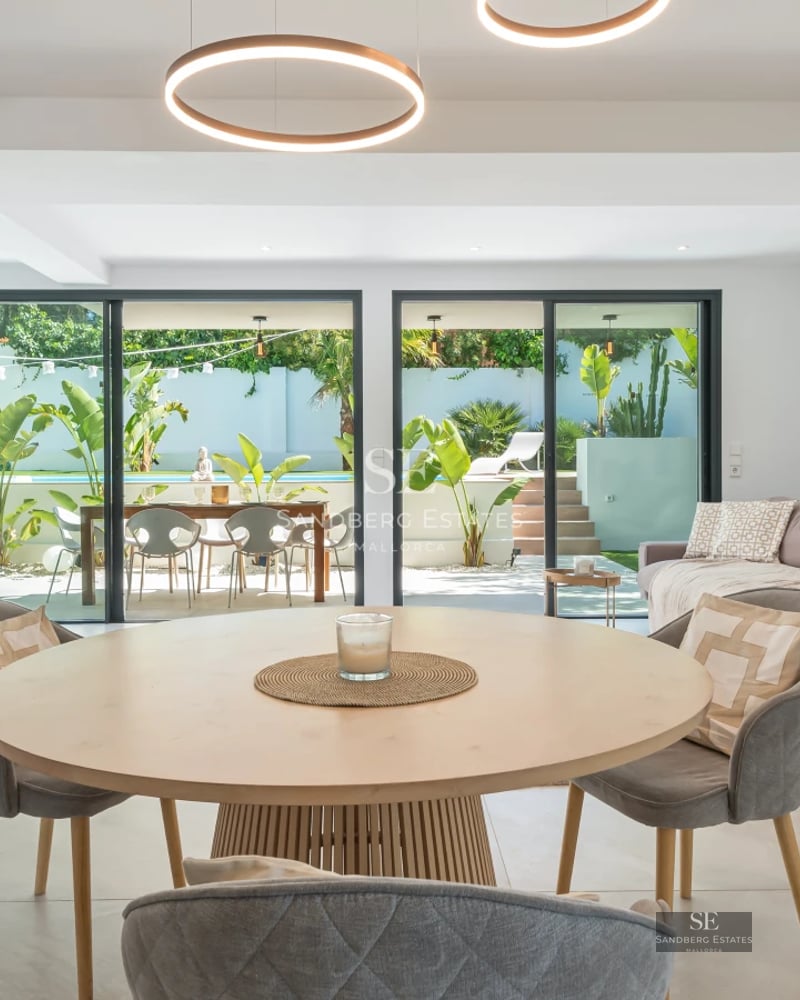 Spacious terrace with infinity pool, modern furniture, and panoramic views. Elegant and minimalist architectural design.