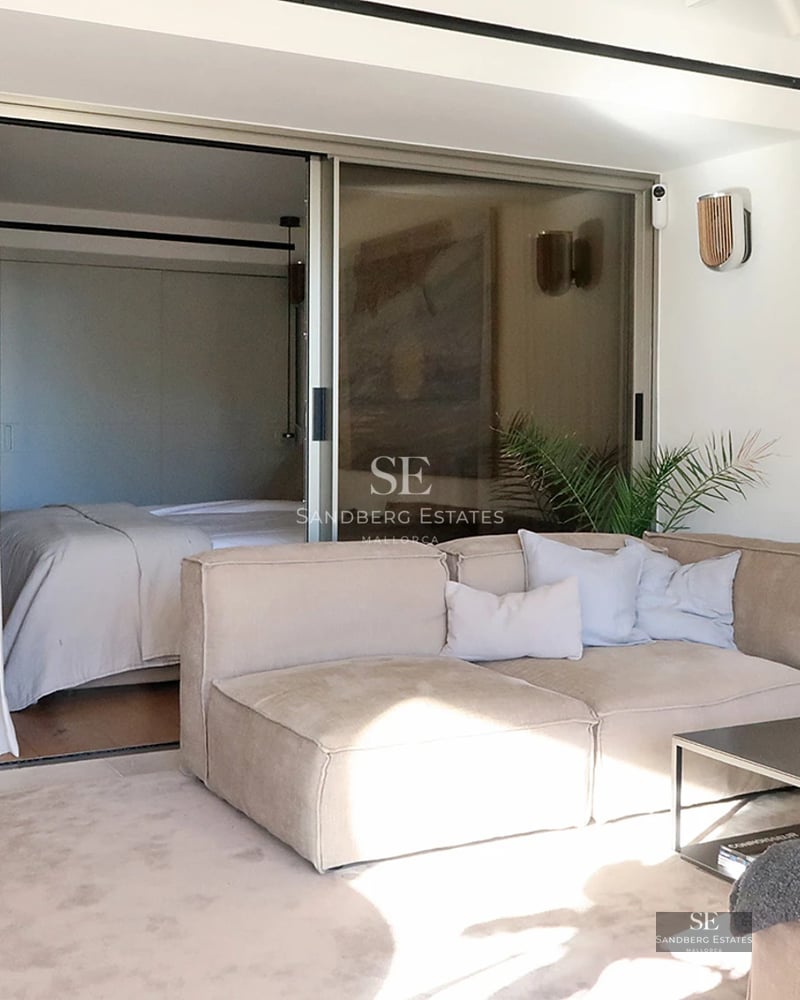 Exterior view of a modern villa featuring a pool, sun loungers, and lush vegetation. Minimalist architecture, soft lighting.
