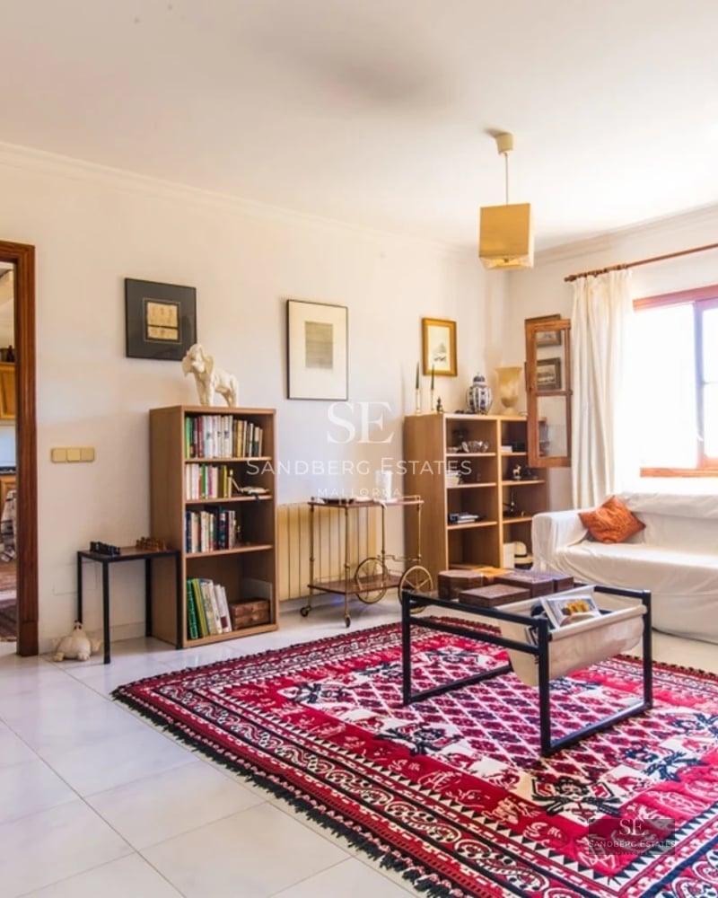 Exterior view of a modern villa featuring an infinity pool, spacious terraces, and manicured gardens. Minimalist architecture with large windows.