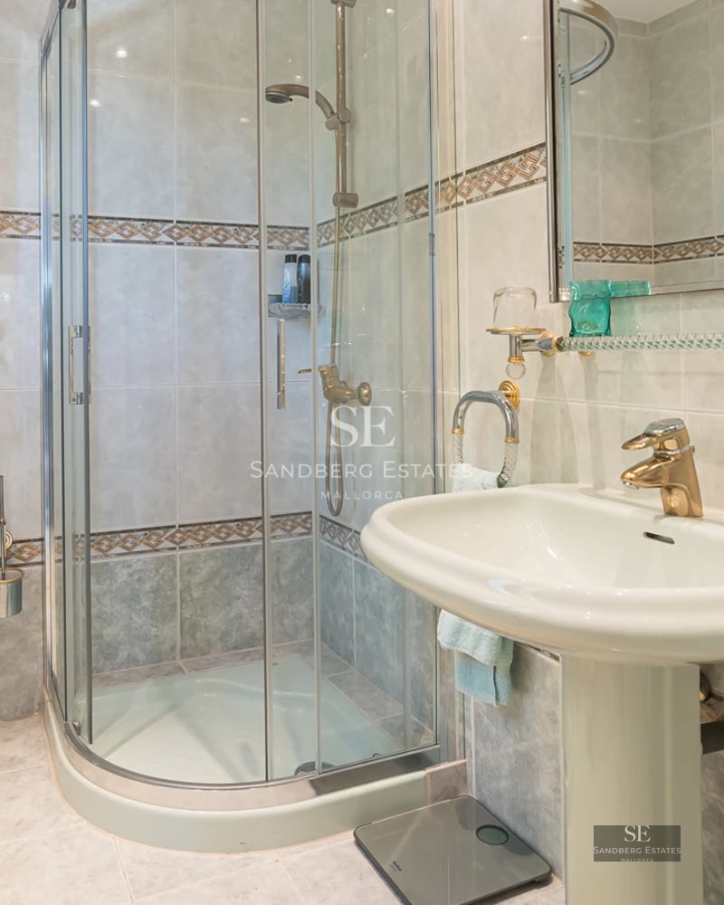 Exterior view of a modern villa with infinity pool, lush gardens, and expansive terraces. Contemporary architecture and manicured landscaping.