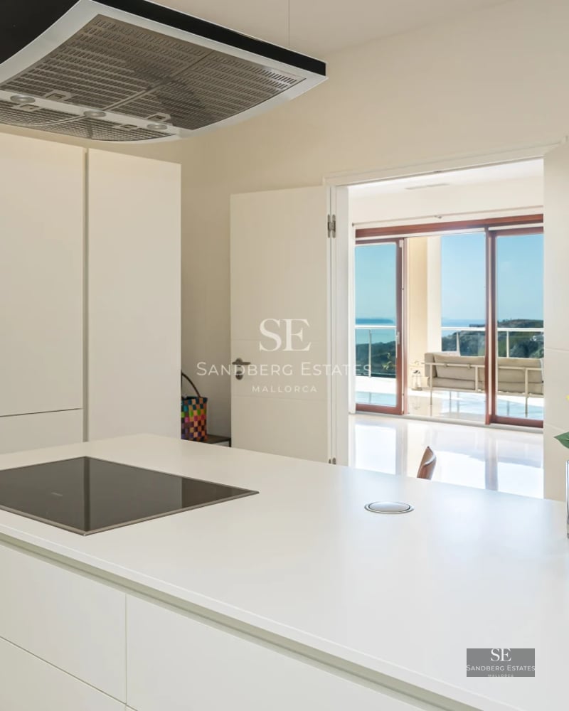 Spacious terrace with swimming pool, modern design, elegant furniture, and panoramic views. Minimalist architecture and high-end finishes.