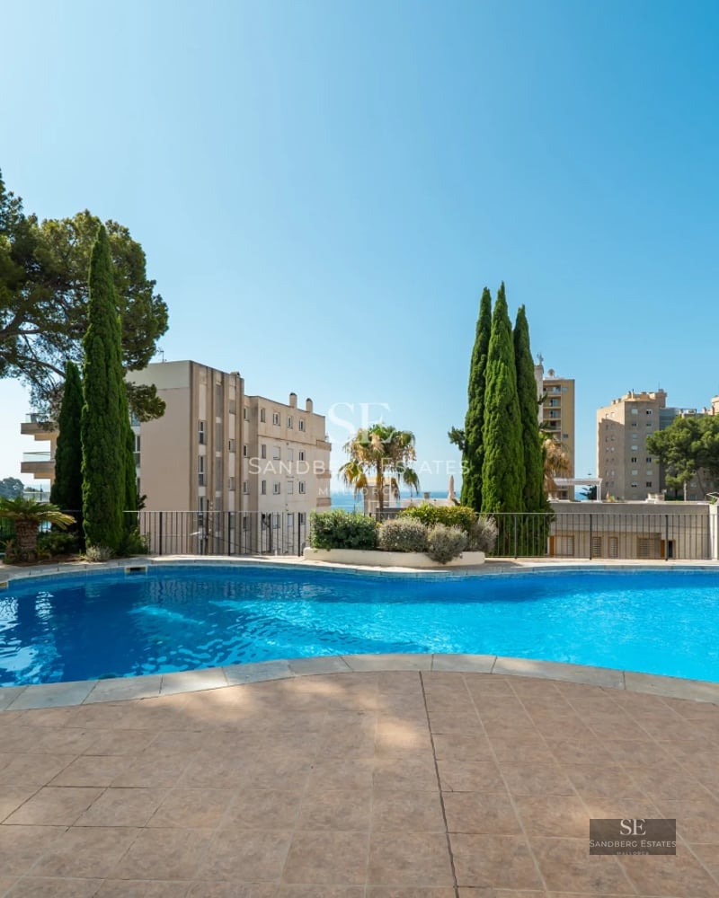 Expansive terrace features an infinity pool, sun loungers, panoramic views and elegant outdoor furniture.